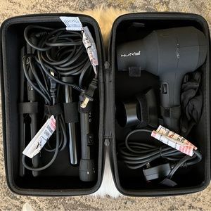 NuMe travel case with hair dryer, straightener, and curling wand